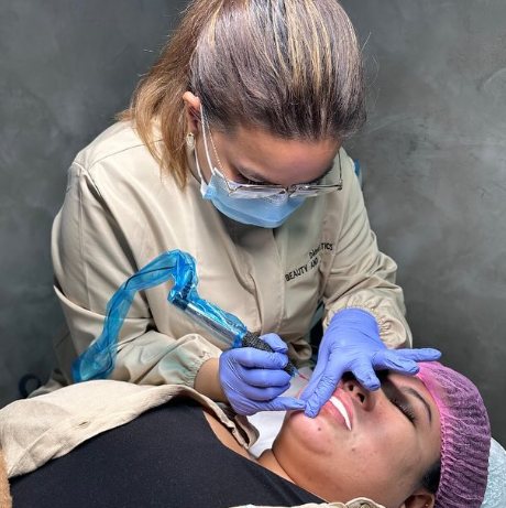 Dane doing a lip blush treatment at D&eacute;tente